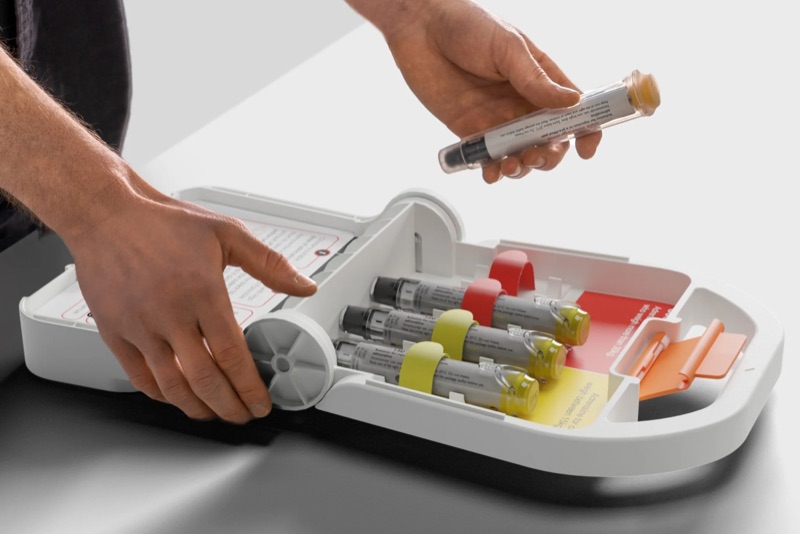 Inside the Kitt: in-date adrenaline auto-injectors — 2×300mcg and 2×150mcg — with treatment instructions